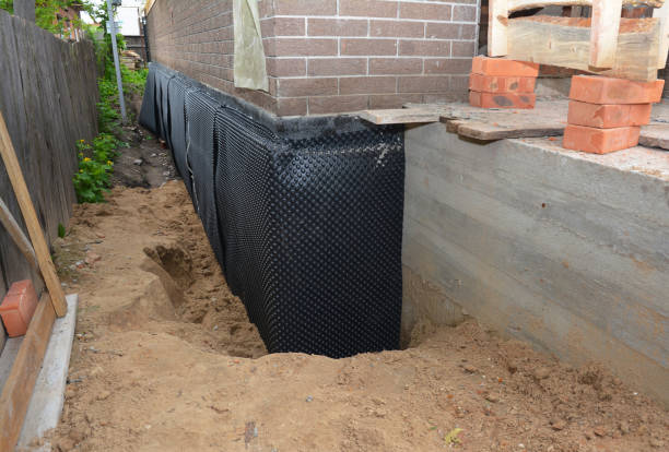 Happy homeowners after waterproofing job in Brookeville
